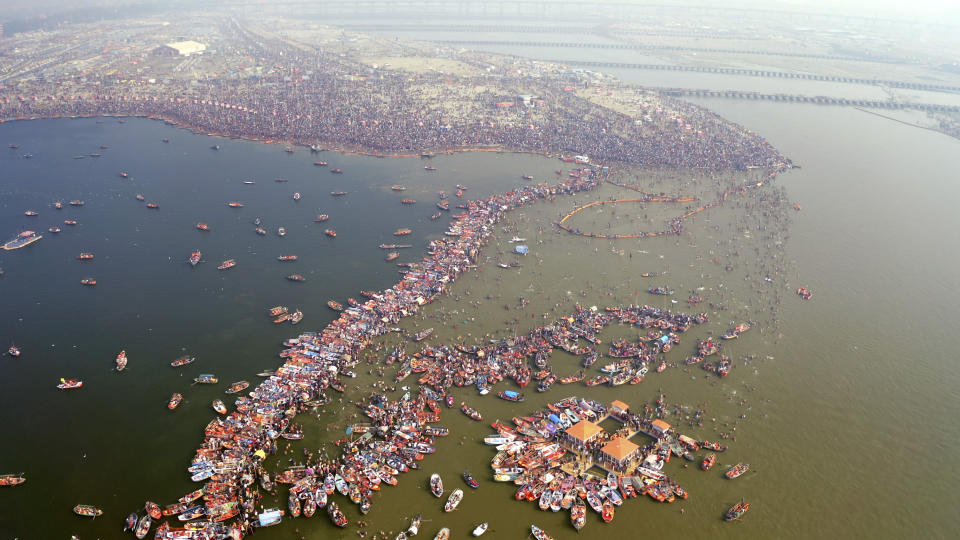 This image released by National Geographic shows a large crowd swimming in the water during a Hindu festival in India, shown in the two-part special "India from Above," narrated by actor Dev Patel. (Gaurav Agarwal/National Geographic via AP)