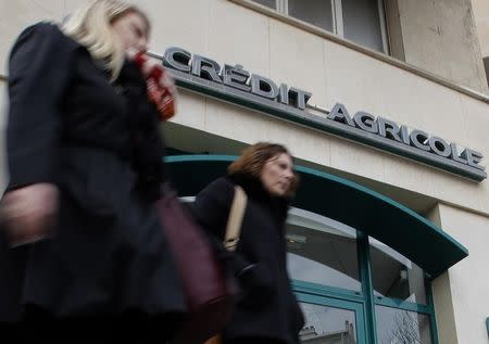 Passers-by walk in front of a branch of French bank Credit Agricole in Marseille February 1, 2013. REUTERS/Jean-Paul Pelissier