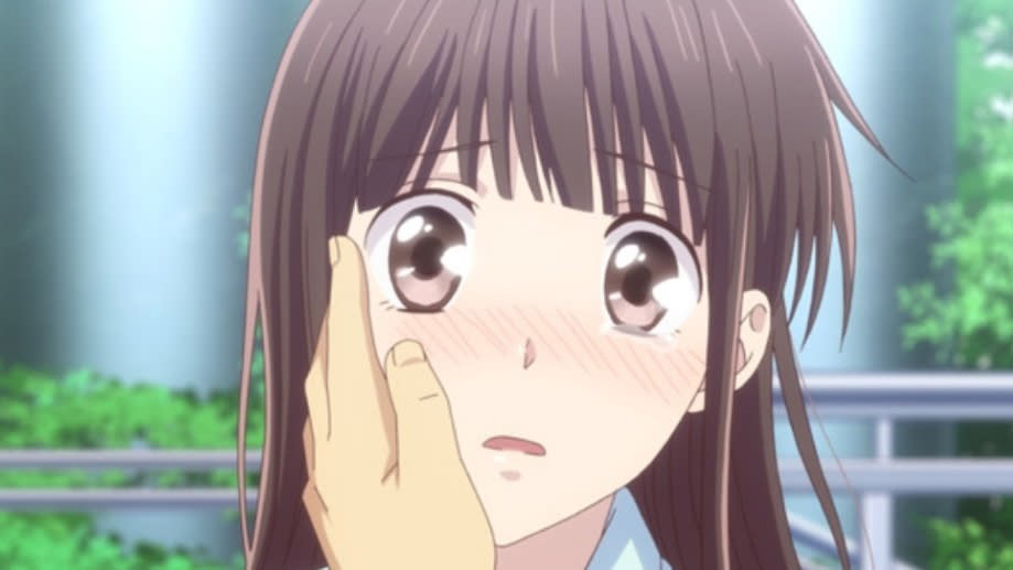 Tohru Honda with a hand on her face in Fruits Basket