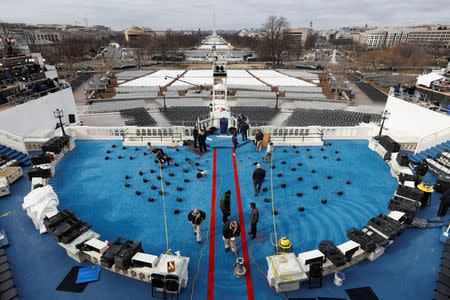 Workers prepare the inauguration of U.S. President Elect Donald Trump at the U.S. Capitol in Washington, DC, U.S. January 19, 2017. REUTERS/Brian Snyder