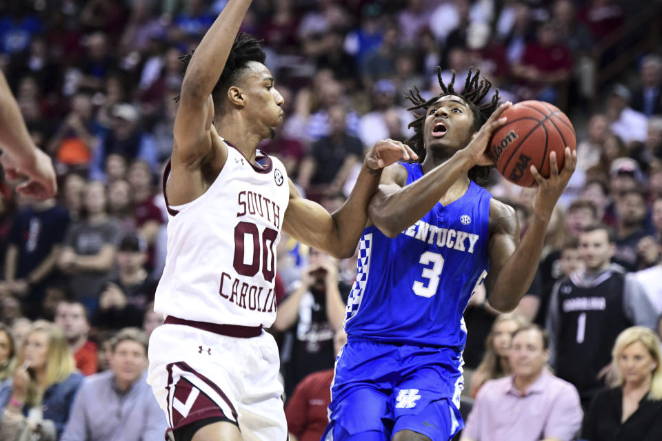 Kentucky guard Tyrese Maxey (3) is defended by South Carolina guard A.J. Lawson (00) during the first half of an NCAA college basketball game Wednesday, Jan. 15, 2020, in Columbia, S.C. (AP Photo/Sean Rayford)