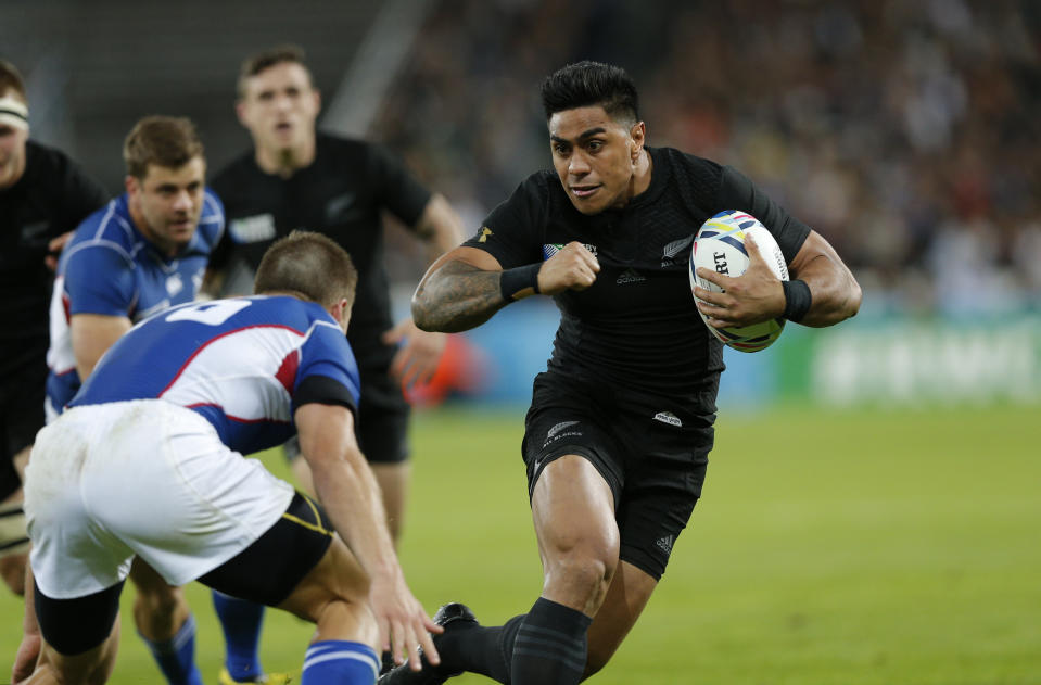 FILE - New Zealand's Malakai Fekitoa, right, runs with the ball during the Rugby World Cup Pool C match between New Zealand and Namibia at the Olympic Stadium, London, on Sept. 24, 2015. A loophole that has allowed rugby players to more easily switch allegiances is helping reshape a sport that has previously tended to tie representative players to one country for life. (AP Photo/Christophe Ena, File)
