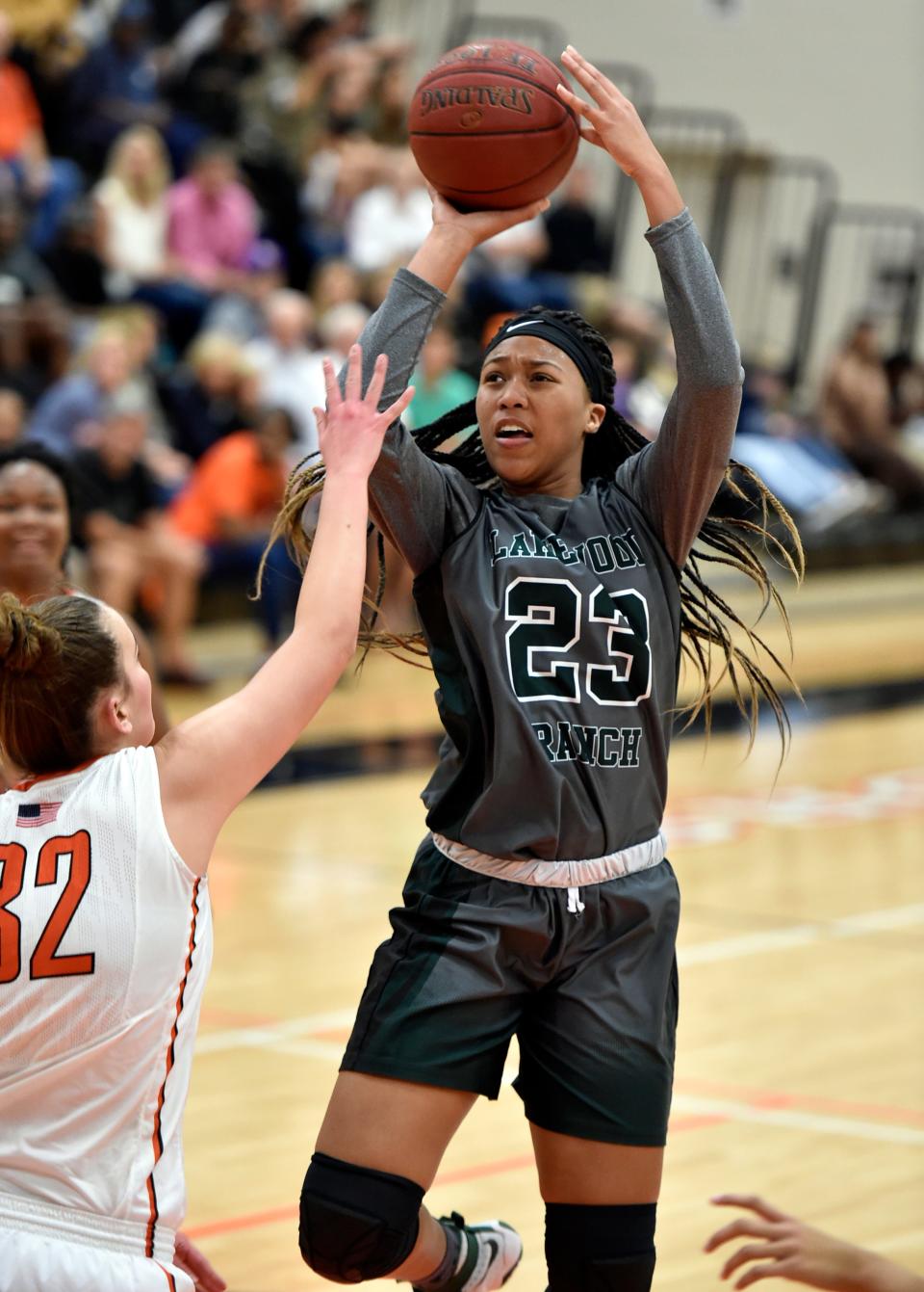 LaDazhia Williams of Lakewood Ranch High scores against Sarasota's Madison Mack during a game Dec. 6, 2016, at Edward F. Howell gymnasium on the campus of Sarasota High.