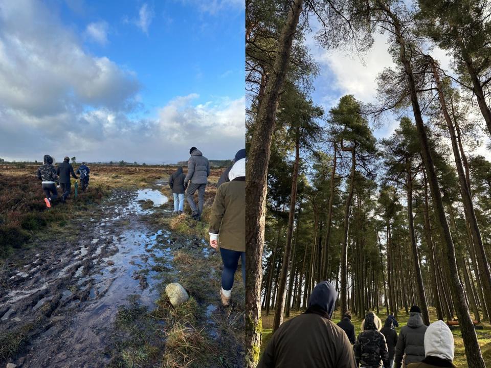 A group of people walking through a muddy field