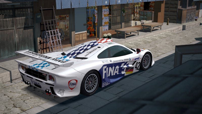 A picture of a McLaren F1 GTR long tail race car from Gran Turismo 4, taken within the game's photo mode