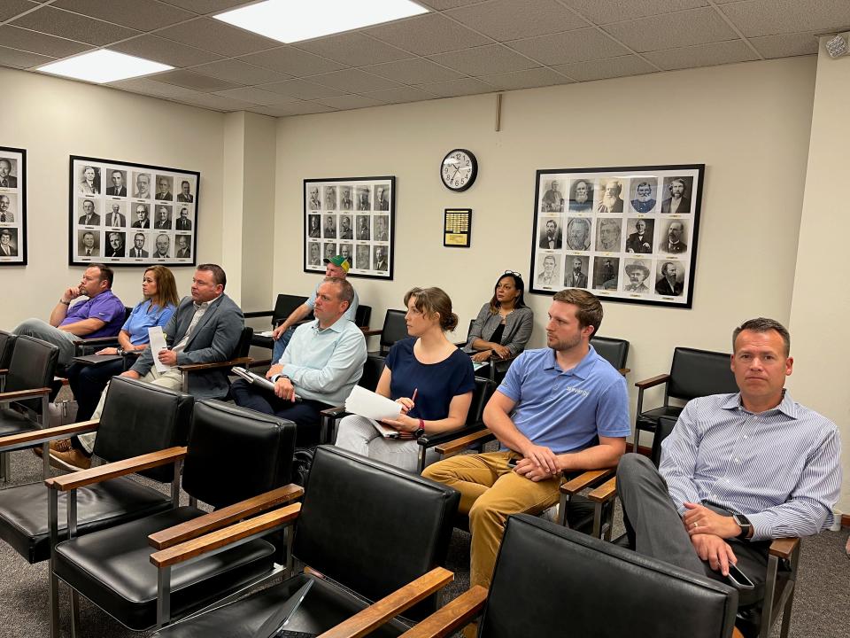 Representatives from Evergy and FreeState Energy observe Monday's Shawnee County Commission meeting. Evergy's plans for a solar field to be built off Auburn Road south of Topeka were denied following residential complaints.