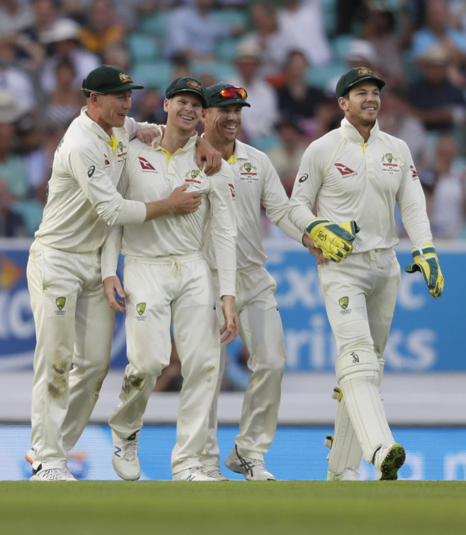 Australia's Steve Smith, second left, celebrates catching England's Chris Woakes during the third day of the fifth Ashes test match between England and Australia at the Oval cricket ground in London, Saturday, Sept. 14, 2019. (AP Photo/Kirsty Wigglesworth)