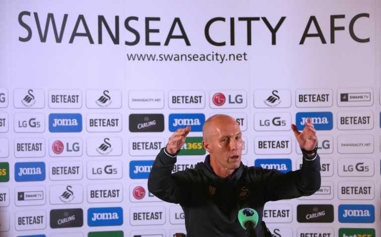 Premier League football club, Swansea City's new US manager Bob Bradley gestures as he hosts a press conference at the Marriot Hotel in Swansea, south wales on October 7, 2016