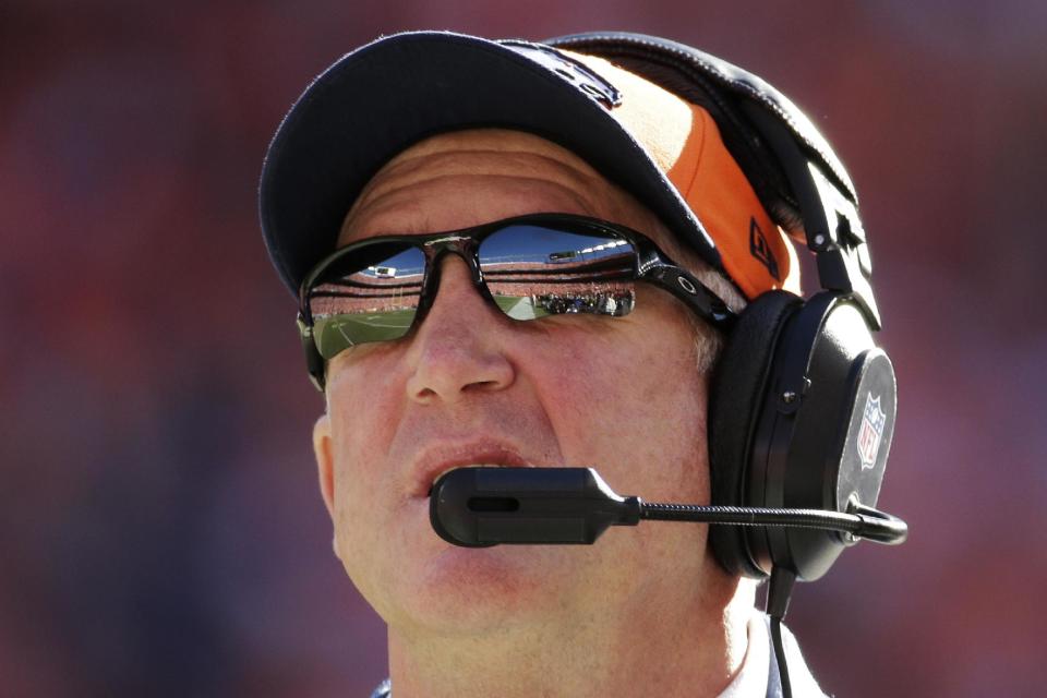 Denver Broncos head coach John Fox watches the action during the first half of the AFC Championship NFL playoff football game between the Denver Broncos and the New England Patriots in Denver, Sunday, Jan. 19, 2014. (AP Photo/Charlie Riedel)