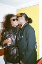 <p>While backstage at the Nelson Mandela concert in London, England, Stevie Wonder greets singer Whitney Houston with a kiss on the cheek. The artists were both involved in the tribute concert, thrown in honor of Mandela's 70th birthday and broadcasted from Wembley Stadium in 1988. </p>