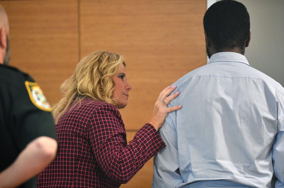 Assistant State Attorney Suzanne O'Donnell talks to Jamaine Brown following his emotional testimony Wednesday, Sept. 13, 2023, where he described how his brothers, Ralph and Tyjuan Williams killed Ralph's girlfriend, Amber Woods in 2006. Ralph Williams is on trial this week for first degree murder at the Manatee County Courthouse in Bradenton.