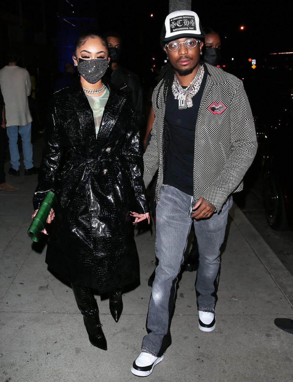 <p>Saweetie and Quavo hold hands as they arrive for dinner on Monday at BOA restaurant in Beverly Hills. </p>