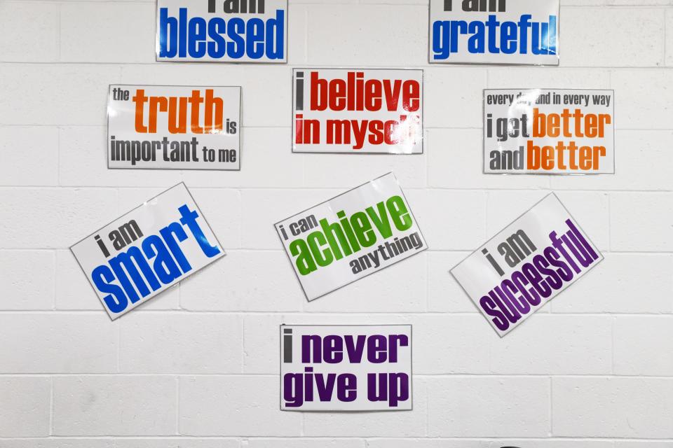 Words of affirmation cover a wall in early July in the New Vision Christian Academy offices, which Ivy Butler also heads.