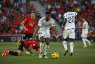 Real Madrid's Aurelien Tchouameni, centre, reacts during a Spanish La Liga soccer match between Mallorca and Real Madrid at the Son Moix stadium in Palma de Mallorca, Spain, Saturday, April 13, 2024. (AP Photo/Francisco Ubilla)