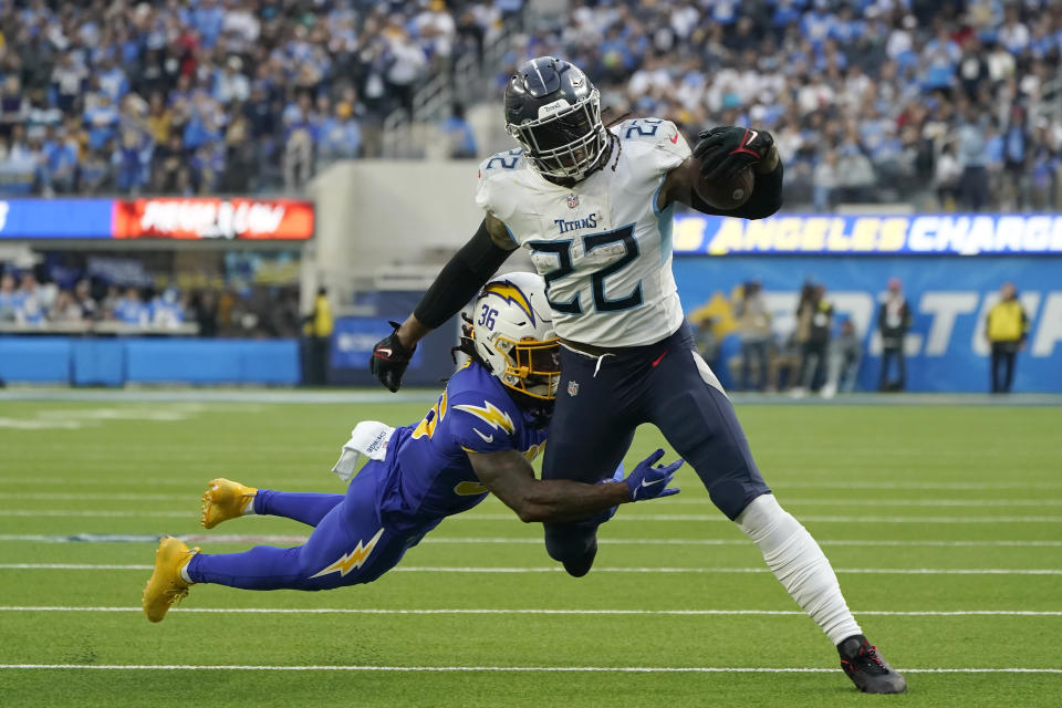 FILE - Tennessee Titans running back Derrick Henry (22) runs against Los Angeles Chargers cornerback Ja'Sir Taylor (36) during the first half of an NFL football game in Inglewood, Calif., Sunday, Dec. 18, 2022. Henry is perhaps the best dominant runner in the game with more than 1,500 yards on the ground in three of the past four seasons. (AP Photo/Marcio Jose Sanchez, File)