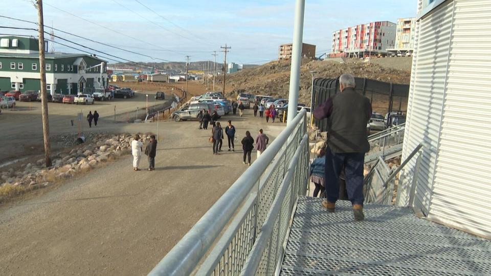 People leaving the Nunavut Court of Justice after the first appearance of the suspect charged in the death of Mary Ann Birmingham.