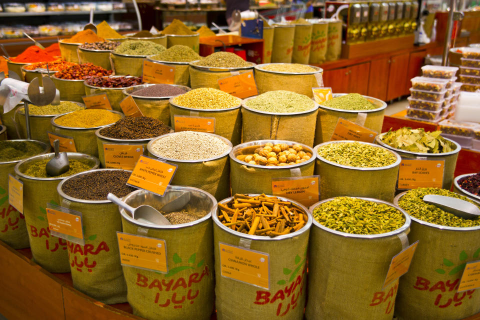 Colorful spices in bins at the Mutrah Souq in Muscat, Oman