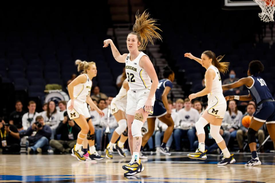 Leigha Brown of the Michigan Wolverines celebrates her 3-point basket against the Penn State Nittany Lions in the first half of the game in the second round of the Big Ten women's basketball tournament at Target Center in Minneapolis on March 2, 2023.