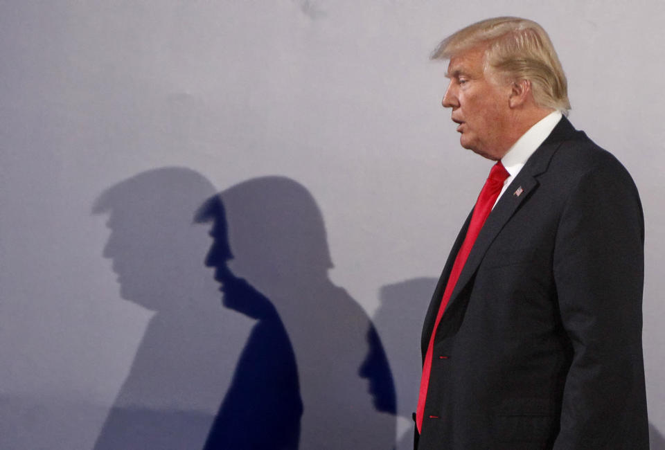 File -- In this Thursday, July 6, 2017 file photo U.S. President Donald Trump casts shadows on the wall as he walks with Poland's President Andrzej Duda at the end of a joint press conference, in Warsaw, Poland. Trump and Duda will meet at the White House on June 24, four days ahead of a presidential election in Poland in which Duda, a conservative, is seeking reelection. The meeting is expected to give Duda a boost, and is seen by some as election interference. (AP Photo/Czarek Sokolowski/file)