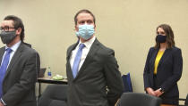 In this image from video, former Minneapolis police Officer Derek Chauvin, center, stands after the verdict is read in his trial for the 2020 death of George Floyd, Tuesday, April 20, 2021, at the Hennepin County Courthouse in Minneapolis, Minn. Standing next to him are attorneys Eric Nelson, left and Amy Voss. (Court TV via AP, Pool)