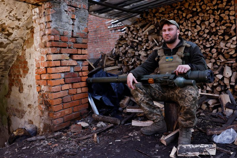 Anti-aircraft unit serviceman of the 10th Mountain Assault Brigade, call sign "Chub", 34, poses for a portrait with a portable anti-aircraft missile system