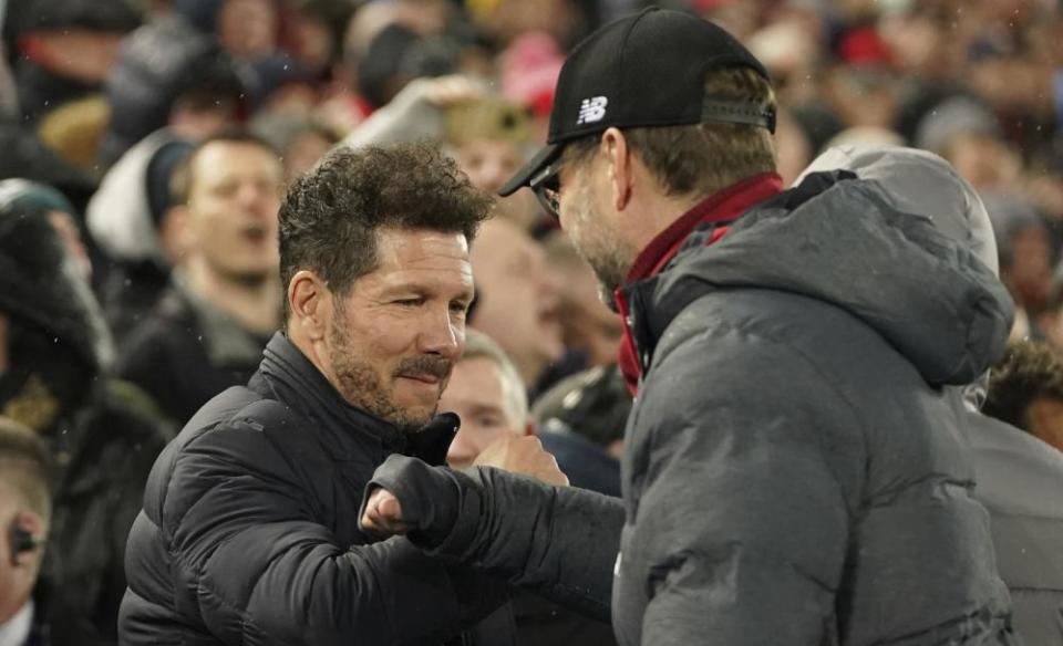 The managers’ pre-match handshake between Diego Simone and Jurgen Klopp was replaced by a forearm bump