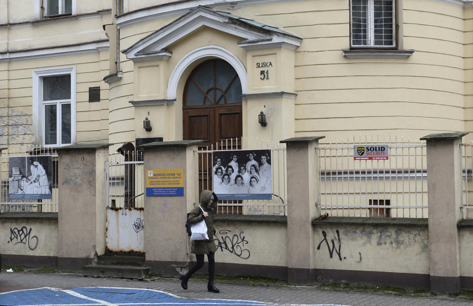 A person walks past the building where the 'Warsaw Ghetto Museum' will be located, in Warsaw, Poland, Friday, Dec. 14, 2018. The Polish government announced plans in March to create a museum dedicated to the Jews imprisoned in the ghetto and tortured and murdered by German forces during their occupation of Eastern Europe. (AP Photo/Alik Keplicz)