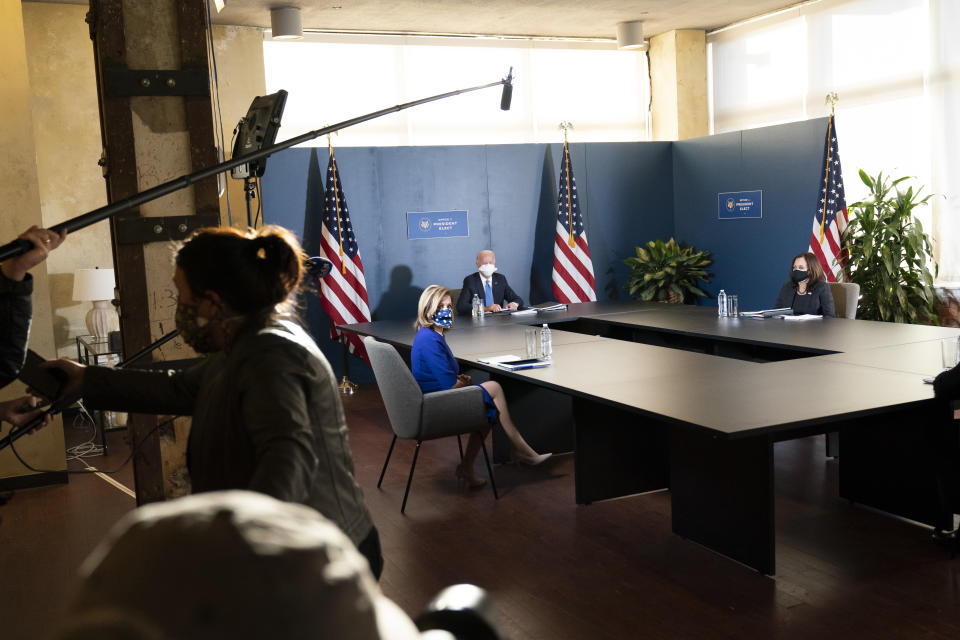 The media are quickly hurried out of the room after a quick photo spray as President-elect Joe Biden, speaks during a meeting with Vice President-elect Kamala Harris, Senate Minority Leader Chuck Schumer of N.Y., and House Speaker Nancy Pelosi of Calif., Friday, Nov. 20, 2020, in Wilmington, Del. (AP Photo/Alex Brandon)