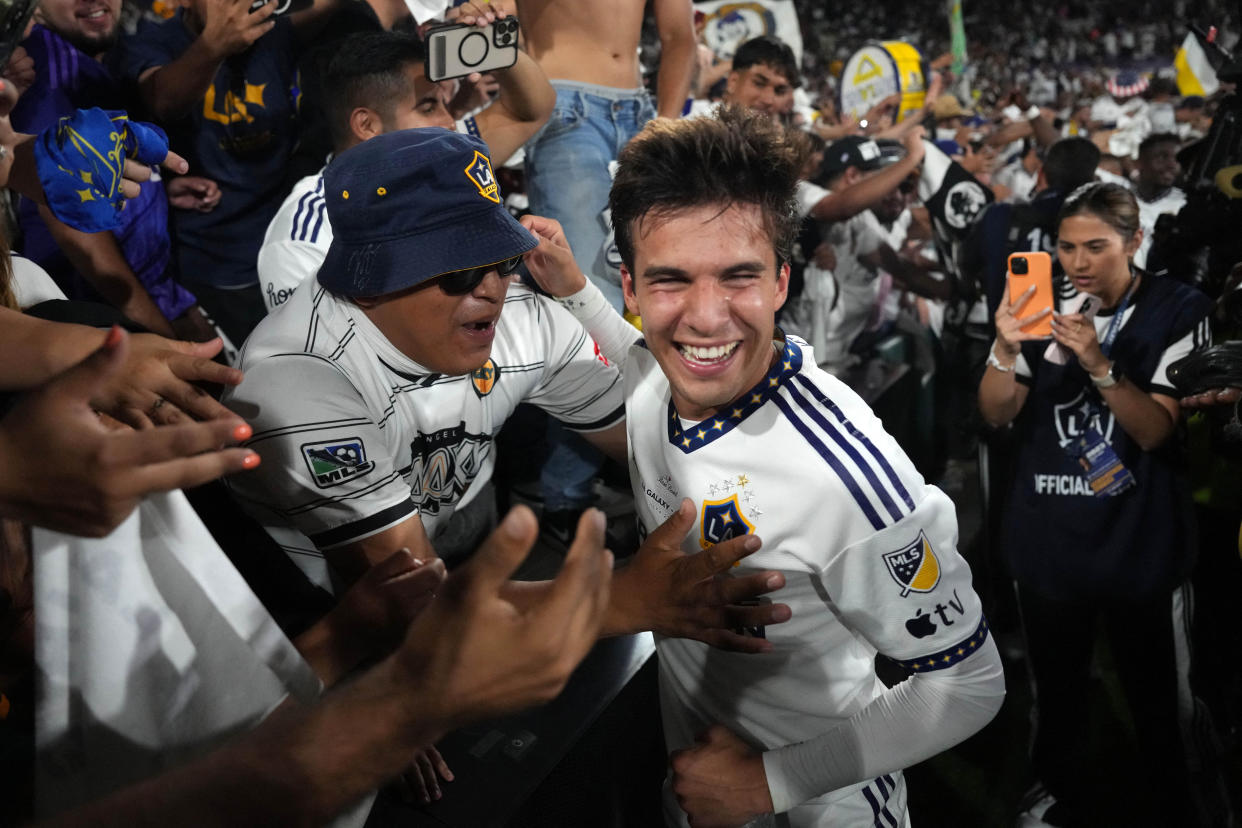 Jul 4, 2023; Los Angeles, California, USA; LA Galaxy midfielder Riqui Puig (6) celebrates with fans after the game against the LAFC at the Rose Bowl. Mandatory Credit: Kirby Lee-USA TODAY Sports