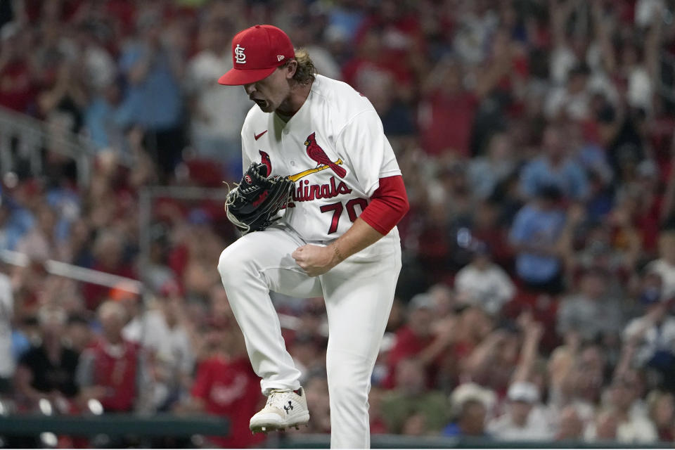 St. Louis Cardinals relief pitcher Packy Naughton celebrates after striking out Los Angeles Dodgers' Cody Bellinger with the bases loaded to end the top of the seventh inning of a baseball game Tuesday, July 12, 2022, in St. Louis. (AP Photo/Jeff Roberson)
