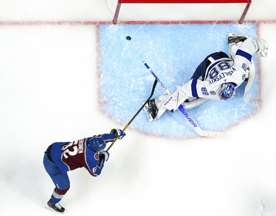 Colorado Avalanche left wing Artturi Lehkonen (62) scores a goal against Tampa Bay Lightning goaltender Andrei Vasilevskiy (88) during the first period of Game 1 of the NHL hockey Stanley Cup Final on Wednesday, June 15, 2022, in Denver. (AP Photo/John Locher)