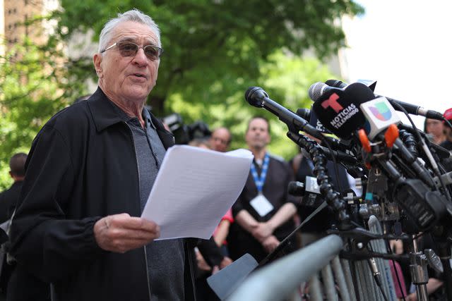 <p>CHARLY TRIBALLEAU/AFP via Getty</p> Robert De Niro speaks outside Manhattan Criminal Court on May 28, 2024