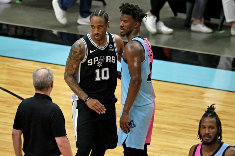 San Antonio Spurs forward DeMar DeRozan (10) hugs Miami Heat forward Jimmy Butler (22) after their game at AmericanAirlines Arena on Wednesday, April 28, 2021 in Miami.