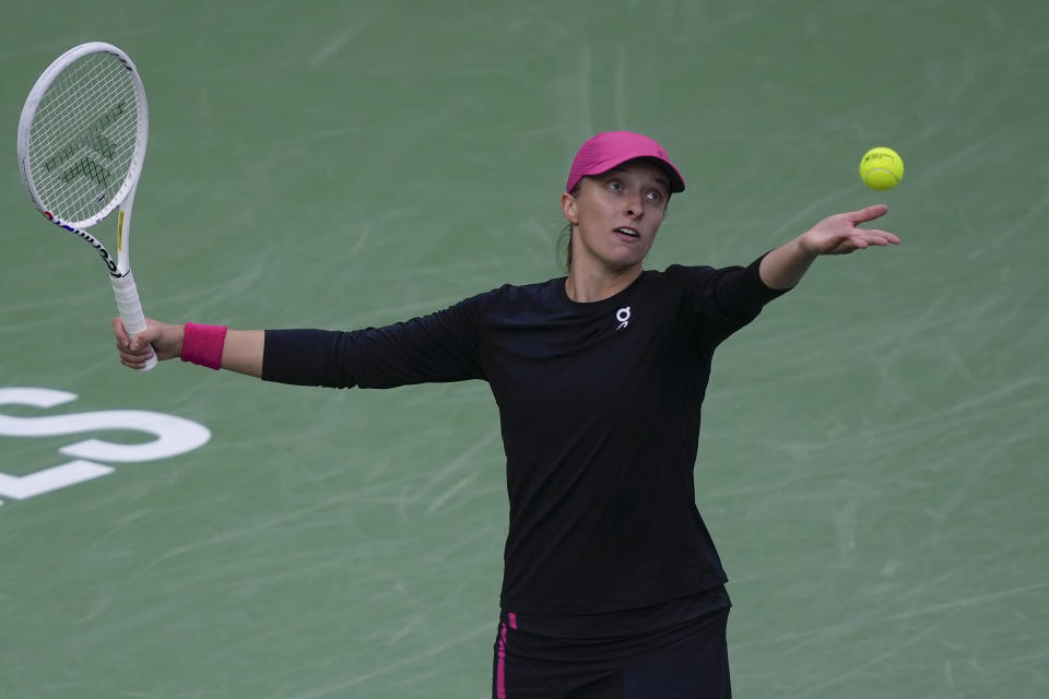 Iga Swiatek, of Poland, serves to Marta Kostyuk, of Ukraine, during a semifinal match at the BNP Paribas Open tennis tournament, Friday, March 15, 2024, in Indian Wells, Calif. (AP Photo/Ryan Sun)