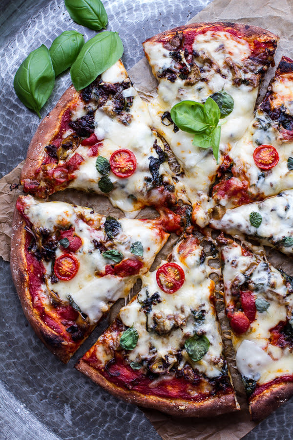 <strong>Get the <a href="http://www.halfbakedharvest.com/cheesy-fontina-caramelized-onion-chorizo-spinach-artichoke-pizza/" target="_blank">Cheesy Fontina Caramelized Onion, Chorizo, Spinach and Artichoke Pizza recipe</a> from Half Baked Harvest</strong>