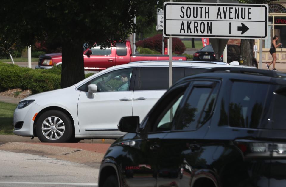 A motorist watches for a chance to enter the Tallmadge Circle from South Avenue.