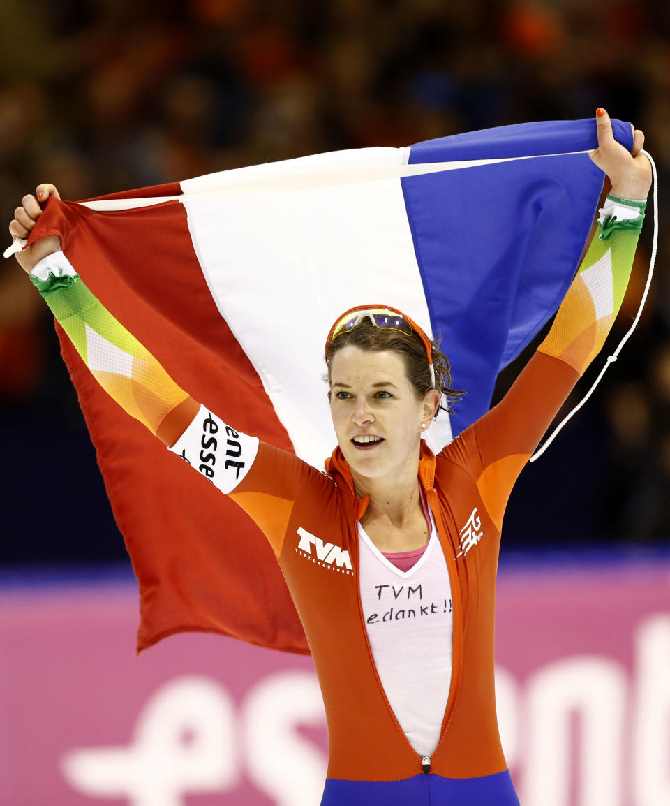 New world champion Netherlands Ireen Wust takes a lap of honor after the women's 5000-meter race during the World Championship allround speedskating at Thialf skating arena in Heerenveen, northern Netherlands, Sunday, March 23, 2014. (AP Photo/Vincent Jannink)