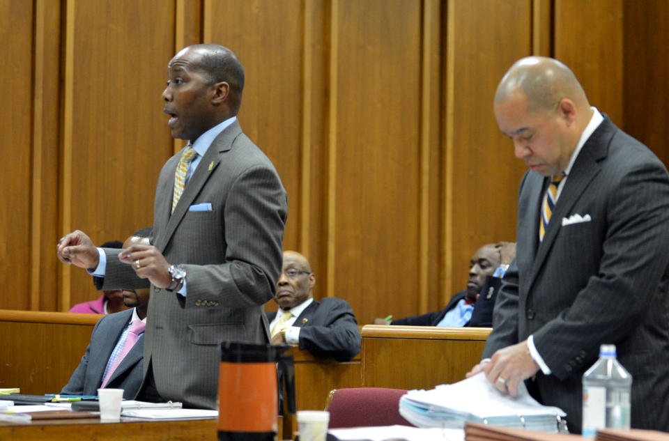 Eric Barnum, left, attorney for Bernice King, speaks to the court as William Hill, attorney for the Estate of Dr. Martin Luther King Jr. Inc., looks over papers during their appearance in Fulton County Superior Court on Wednesday, Feb. 19, 2014, in Atlanta. The case puts brothers Martin Luther King III and Dexter King against Bernice King over the possession of their father's Nobel Peace Prize and personal Bible. (AP Photo/Atlanta Journal-Constitution, Kent D. Johnson) MARIETTA DAILY OUT; GWINNETT DAILY POST OUT; LOCAL TV OUT; WXIA-TV OUT; WGCL-TV OUT.