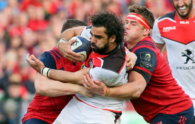 Toulouse's French winger Yoann Huget is tackled during their European Champions Cup quarter-final rugby union match against Munster at Thomond Park in Limerick, Ireland on April 1, 2017