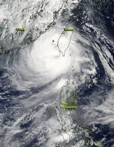 Image provided by NASA shows Typhoon Tembin after it had crossed southern Taiwan and re-emerged into the waters of the Philippine Sea on August 24. On its current track, Tembin was forecast to make landfall again in Pingtung and move northward off the east coast