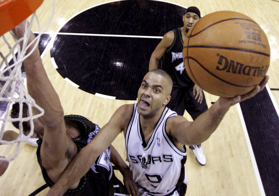 FILE - San Antonio Spurs guard Tony Parker (9), of France, drives to the basket as Minnesota Timberwolves guard Markoi Jaric (55) defends during the first quarter of their NBA basketball game in San Antonio, Jan. 6, 2006. Parker was announced Friday, Feb. 17, 2023, as being among the finalists for enshrinement later this year by the Basketball Hall of Fame. The class will be revealed on April 1. (AP Photo/Eric Gay, File)