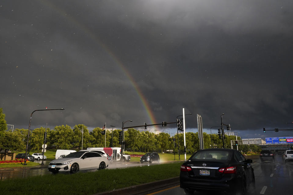 A rainbow arches over the road near Midway International Airport in Chicago following severe weather, Wednesday, July 12, 2023. (AP Photo/Nam Y. Huh)