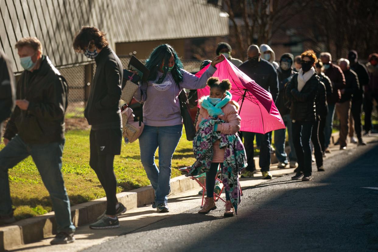 Voters wait in a long line to vote in Atlanta on the first day of in-person early voting for the U.S. Senate runoff election in Georgia on Dec. 14, 2020.  (Photo: Jason Armond / Los Angeles Times via Getty Images)