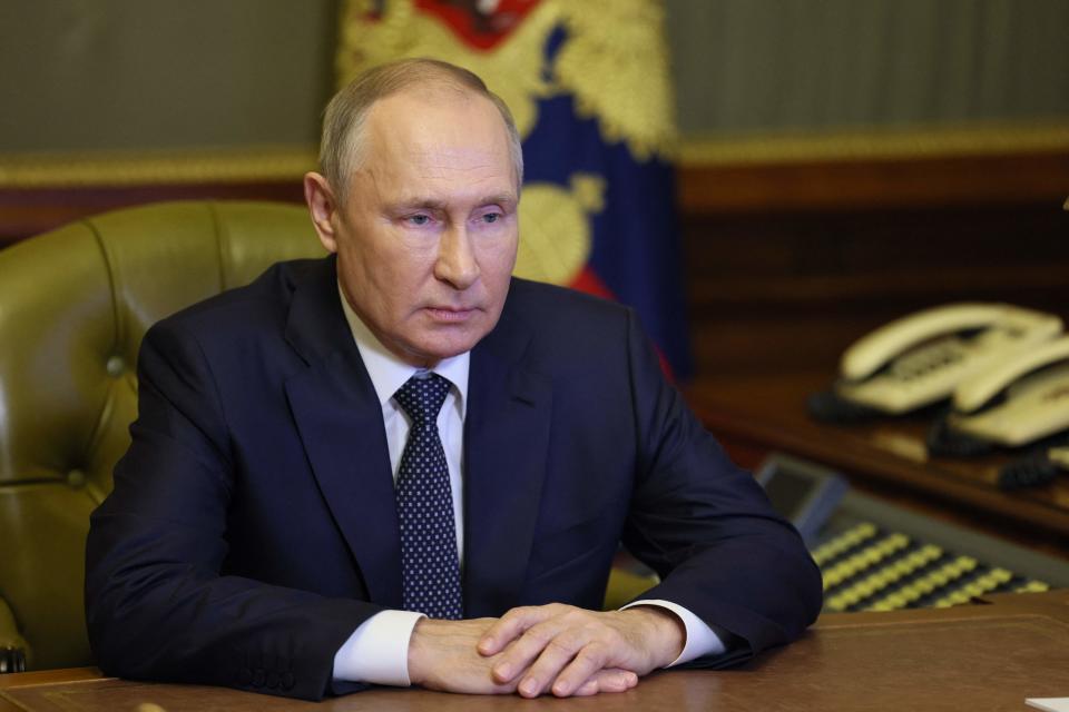 Russian President Vladimir Putin chairs a Security Council meeting via a video link in Saint Petersburg (SPUTNIK/AFP via Getty Images)