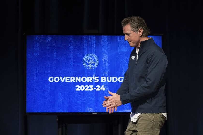 California Gov. Gavin Newsom leaves the stage after delivering his budget proposal in Sacramento, Calif., Tuesday, Jan. 10, 2023. California faces a projected budget deficit of $22.5 billion for the coming fiscal year, Newsom announced Tuesday, just days into his second term. It's a sharp turnaround from last year's $98 billion surplus. (AP Photo/José Luis Villegas)