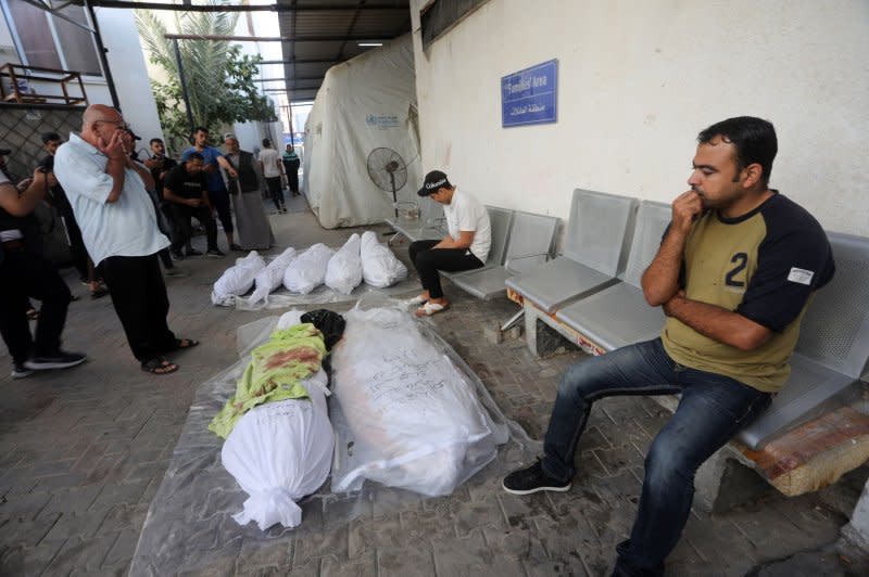 Bodies wait to be taken for burial Monday after eight members of a family were killed in an Israeli airstrike on Rafah in the southern Gaza Strip. Photo by Ismael Mohamad/UPI