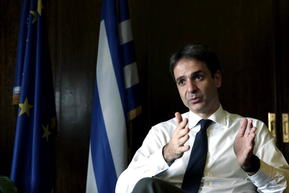 Greek Administrative Reform Minister Kyriakos Mitsotakis speaks during an interview with the Associated Press in Athens, Tuesday, April 8, 2014. Mitsotakis said years of austerity have left Greece with about 200,000 fewer civil servants than before its debt crisis erupted in late 2009. He added that the country has made significant overall progress, which should allow it to tap international capital markets "in the foreseeable future." (AP Photo/ Petros Giannakouris)