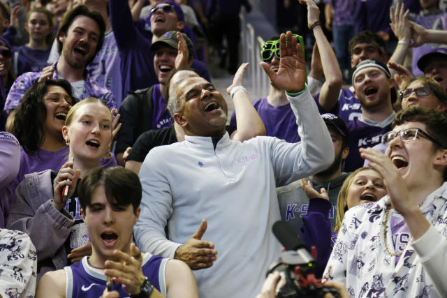Kansas State head coach Jerome Tang, center, celebrates his team's 75-65 win over Baylor with fans during the second half of an NCAA college basketball game, Tuesday, Feb. 21, 2023, in Manhattan, Kan. (AP Photo/Colin E. Braley)