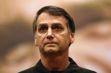 FILE PHOTO: Presidential candidate Jair Bolsonaro is pictured during a news conference in Rio de Janeiro, Brazil October 11, 2018. REUTERS/Ricardo Moraes/Files