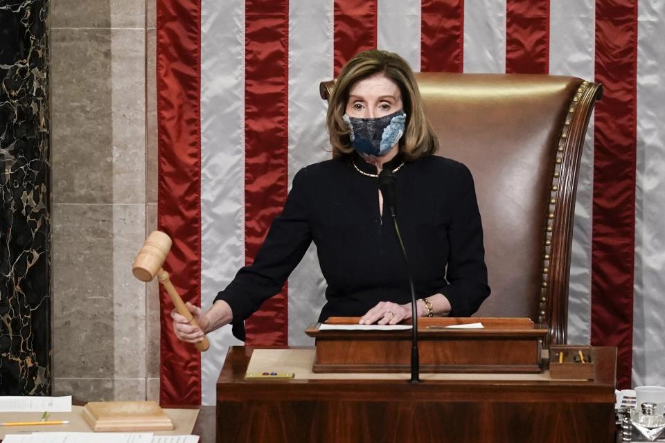 Speaker of the House Nancy Pelosi, D-Calif., gavels in the final vote of the impeachment of President Donald Trump, for his role in inciting an angry mob to storm the Congress last week, at the Capitol in Washington, Wednesday, Jan. 13, 2021.